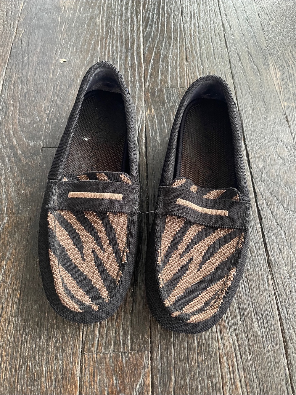 Rothy’s Black and Tan Zebra Slip-On Loafers
